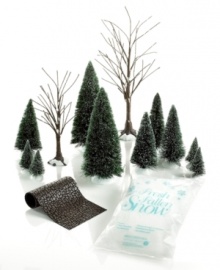 Bring the natural beauty of the season to your Christmas village with the Department 56 landscaping set. Frosted evergreens and bare-branched trees will line a cobblestone road.