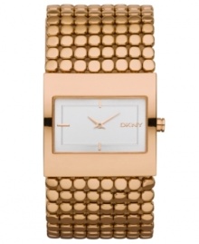 A polished and highly detailed timpiece from the always classy DKNY. Watch crafted of rose-gold tone stainless steel bracelet and rectangular case. White dial features rose-gold tone two hands, stick indices at six, nine and twelve o'clock and logo at three o'clock. Quartz movement. Water resistant to 30 meters. Two-year warranty.