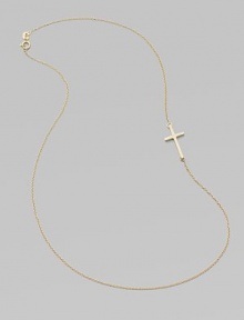 A wispy chain of 14k yellow gold features a cross pendant set askew for a modern edge.14k yellow gold Length, about 16 Pendant length, about ¾ Spring ring clasp Made in USA