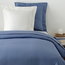 From the name synonymous with luxury bedding, this Edmond Frette sham in luminous sateen jacquard lends regal elegance to your bedding collection.