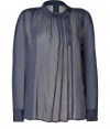 Both feminine and flattering, 2nd Days pleated sheer top is a romantic take on contemporary workwear - Twisted round collar with snap and button closures, long sleeves, buttoned cuffs, pleated front, longer back - Easy feminine fit - Team with delicate camisoles and trend favorite leather leggings, or tuck into pencil skirts with statement heels