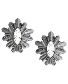 Beautiful bursts. This pair of stud earrings from Givenchy is crafted from hematite-tone mixed metal with glass crystals bringing the luster. Approximate drop: 1-1/4 inches.