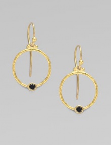 From the Clover Collection. A simple, delicate hoop of 24K gold with a single black diamond accent.Black diamond, 0.24 tcw 24K yellow gold Width, about ¾ Length, about 1 Ear hooks Imported 