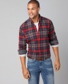 Your rugged look charms with this plaid Tommy Hilfiger shirt.