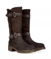 Up the style quotient of your cold weather look with these rugged-luxe shearling boots from Rossano Bisconti - Round toe, chunky sole and block heel, supple suede, mid-shaft length, dual buckle and strap detail, shearling lining - Pair with pleated wool short with ribbed tights and an oversized cashmere sweater