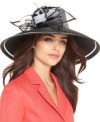 Simply divine: This glamorous church hat boasts a romantic, oversized silhouette and is topped with an eye-catching accent of floral and feather detail.