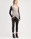 Contrasting sleeves and an asymmetrical hi-lo hem add urban charm to this uniquely textured boucle sweater. ScoopneckLong sleevesAsymmetrical hi-lo hemBack hem hits below the hips30% alpaca/30% mohair/24% viscose/16% nylonDry cleanImported of Italian fabricModel shown is 5'10 (177cm) wearing US size Small.