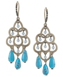 Update your look with intricate design and a touch of color. Carolee's elegant chandelier earrings feature a cut-out teardrop design with reconstituted turquoise drops and faceted glass beads. Set in burnished gold-plated mixed metal. Approximate drop: 2-3/4 inches.