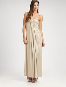 This dazzling, flowy design features an alluringly low-draped back and a jeweled cutout detail at the bust.Strapless necklineJeweled cutout detailRuched bustGathered frontLow draped back with gathered back panel strapAbout 44 from natural waist91% polyester/9% spandexHand washMade in USA of imported fabric