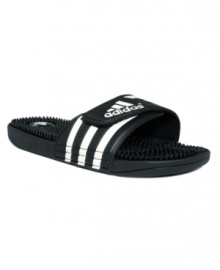 Lightweight and super comfortable, these smooth slide men's sandals from adidas feature tiny nubs at the foot bed for a feel-good massaging effect with every step.