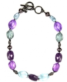 Chic and colorful! A pretty palette of purple hues--along with gray and blue--set the tone for this stylish Jones New York collar necklace. Featuring an array of beads in varying shapes and sizes, it's made in hematite tone mixed metal. Approximate length: 17 inches + 2-inch extender.