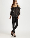 Breezy leopard-print silk hangs off the shoulders in this ruffled topper.Wide strapsOpen shouldersGathered sleevesPullover styleAbout 27 from shoulder to hemSilkDry cleanImported of USA fabric