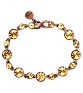 Shine like the sun. Givenchy's flex bracelet is crafted from brown gold-tone mixed metal. Light Colorado topaz accents add sparkle. Approximate length: 7-3/8 inches.