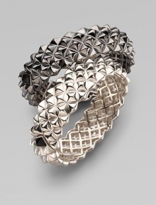 Fabulously crafted bangle of blackened sterling silver displays a sculptural stud pattern with one contrasting stud at the clasp. Sterling silver Diameter, about 2½ Width, about ¾ Hinged with clasp Imported Please note: Bracelets sold separately.