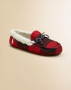 A classic slip-on slipper lined in plush faux shearling with a preppy woven plaid design.Slip-onWool upperFaux shearling liningRubber solePadded insoleImported