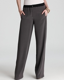 Cut in sumptuous silk, these black Vince pants feature a smart navy trim for a sophisticated turn at office style. Complement the detail with a tailored blouse and glossy pumps and call on clients with the utmost confidence.