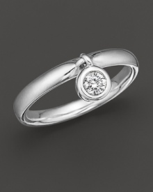 An elegant white gold band with a hanging .20 ct diamond bezel charm. Designed to be stackable with other charm rings.