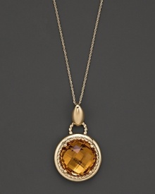 An expertly-rendered, faceted round citrine pendant set in 16 Kt. gold, with fine link chain.