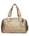 Imaginative quilting and a ferociously cute metal lion charm make this handbag a trendsetter this season.