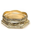 A gold nugget design lends luxe texture to these stacked bangles from Belle Noel.