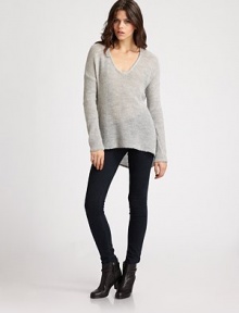 A featherweight pullover tailored with a modern dropped shoulder and asymmetrical hemline.V necklineDropped shouldersLong sleeves50% alpaca/50% merino woolDry cleanImported