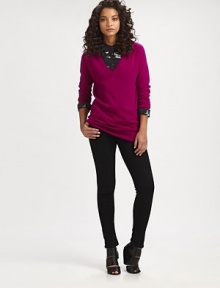 Pure cashmere sweater in a menswear-inspired silhouette with a plunging v-neck, dropped shoulders and long dolman sleeves. Ribbed v-neckDropped shouldersDolman sleevesRibbed cuffs and hemLonger length hits below the hipsAbout 30 from shoulder to hemCashmereDry cleanImportedModel shown is 5'10 (177cm) wearing US size Small.