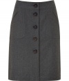 A polished staple for your workwear wardrobe, Steffen Schrauts grey flannel skirt is an elegant, everyday indispensable - Slim pencil cut, with medium-width banded waist and button placket extending from navel to mid-thigh - Oversize aprom pockets at hips and decorative seams - Pair with a button down and light cashmere cardigan or a silk blouse and style with classic pumps or loafers