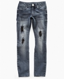 Grunge meets glam in these distressed Guess jeans styled with tears, sequins and attitude.