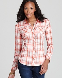 Featuring a vibrant plaid print, a menswear-inspired GUESS shirt lends boyish charm to your favorite jeans.