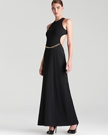 A racerback silhouette lends a dressed up, sporty look to BCBGMAXAZRIA's chain-belted gown.