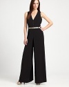 Timelessly stylish, this wide-leg jumpsuit features a sultry neckline and a chic belt.Deep v-neckSleevelessBelt loopsBelt includedAbout 33 from natural waist76% triacetate/21% polyester/3% polyurethaneDry cleanImported Model shown is 5'10 (177cm) wearing US size 4. OUR FIT MODEL RECOMMENDS ordering true size. 