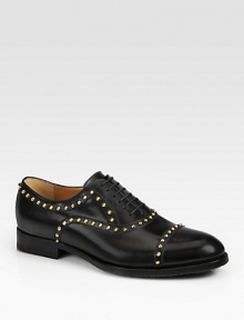 Black leather with antiqued gold cone-shaped stud hardware.Leather sole with micro GG rubber reinforcementMade in Italy