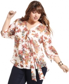 Look beautiful in blossoms with Eyeshadow's three-quarter-sleeve plus size blouse, accented by a tie closure.