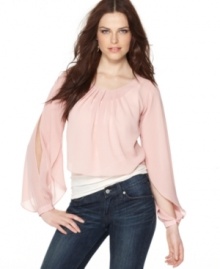 Like pretty petal, BCBGeneration's blouse features delicately-wrapped sleeves for a fresh look! The cropped hem looks great with high-waisted jeans and skirts, too.