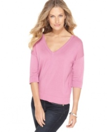 Cable & Gauge gives a basic piece a new look: this V-neck sweater features chic buttons along the back!