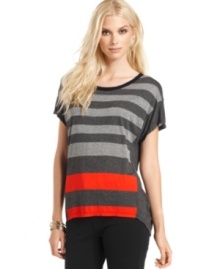 Shine on in this graphic striped top from Calvin Klein Jeans, complete with bold metallic and solid stripes. The asymmetrical hem is right on-trend, too!