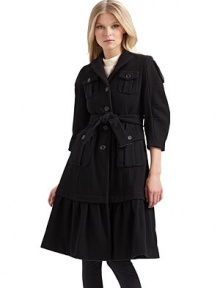 Military styling fused with ladylike influences for a luxurious wool overcoat that commands attention.Notched collar ¾ puffed sleeves with button tabs Front button closure Front button flap pockets Buckled belt ties at the waist Long ruffled hem About 40 from shoulder to hem Fully lined Wool; dry clean Made in Italy