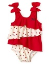 Sweet hearts, bows and flitty asymmetric ruffle tiers adorn this playful Juicy Couture swim suit.