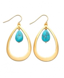 Memories of warm ocean waves, by Lauren by Ralph Lauren. Earrings feature sleek gold tone mixed metal teardrops with bright semi-precious reconstituted turquoise stones at center. Approximate length: 2 inches.