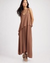 Draped jersey knit hangs in a chic, asymmetrical silhouette for modern styling.Scoopneck Wide straps Asymmetrical hem Scoopback 97% modal/3% spandex Hand wash Imported