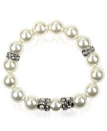 Exude timeless elegance in effortless, slip-on style. Givenchy bracelet features polished glass pearls accented by silver tone mixed metal beads and sparkling crystals. Bracelet stretches to fit wrist. Approximate diameter: 2-1/2 inches.