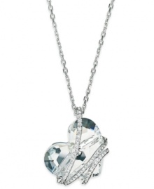 Fall in love with this pendant necklace from Swarovski. With a clear crystal heart wrapped in a crystal pave cage, this design becomes a romantic creation. Crafted in rhodium-plated mixed metal. Approximate length: 16 inches + 2-inch extender. Approximate drop: 1 inch.