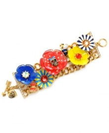 Style that's not for the shy. Betsey Johnson's head-turning toggle bracelet combines boldly-hued solid and patterned flowers in blue, green, red and yellow enamel. Charms include a blue striped bee, a crystal-accented skull, and a detailed butterfly. Crafted in gold-plated mixed metal. Approximate length: 7-1/2 inches.