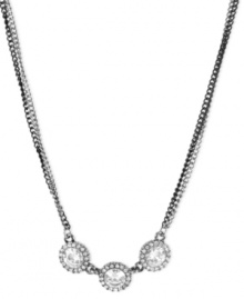 Circular chic. Betsey Johnson's necklace, crafted from silver-tone and hematite-tone mixed metal, dazzles with three round glass crystals in the center offset by crystal accents for a sparkling touch. Approximate length: 16 inches + 3-inch extender. Approximate drop: 3/8 inch.