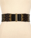 Bring the heavy metal with this wide stretch belt from Steve Madden. Dare to add a little industrial-chic to your workday look.