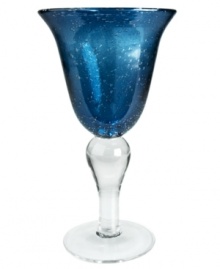 The eye-catching Iris goblet makes a big impact in any setting with a cool slate-blue hue and tiny bubbles trapped in dishwasher-safe glass. From Artland.