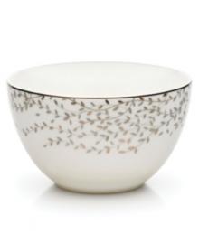 Fringed with shimmering leaves of platinum and mica, this bone china fruit bowl turns your table into a springtime utopia. Its sleek coupe shape is a vision of modern elegance in platinum-banded white.