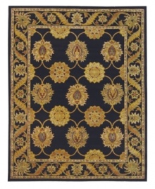 Bring home thousands of years of rug-making heritage with this spectacular area rug from Safavieh. Tufted in India from pure wool, this rug boasts a traditional motif of verdant blossoms that play boldly against a rich black ground. (Clearance)