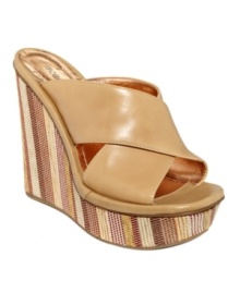 Touch the sky in these towering platform slide sandals by BCBGeneration. The Ferrara features chunky crisscross straps and a fun, striped fabric-covered wedge.