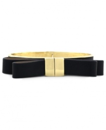 Keep it  black tie with a little help from Vince Camuto. A golden setting flaunts a black leather strip in a bow tie design. Crafted in gold tone mixed metal. Approximate diameter: 2 inches.